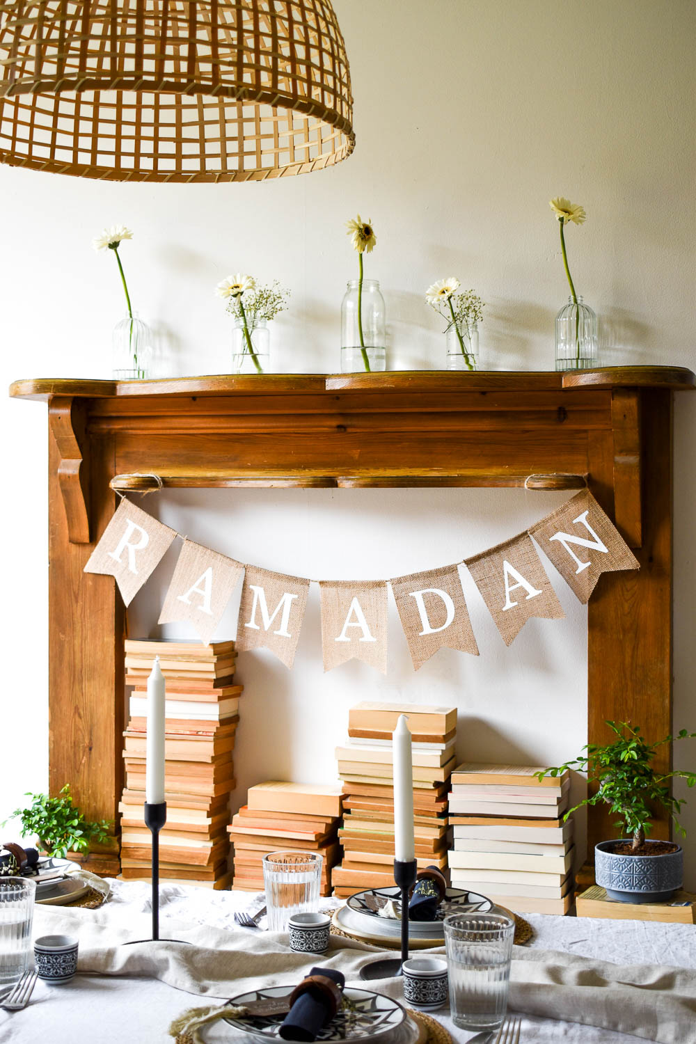 Ramadan banner on faux fireplace behind table