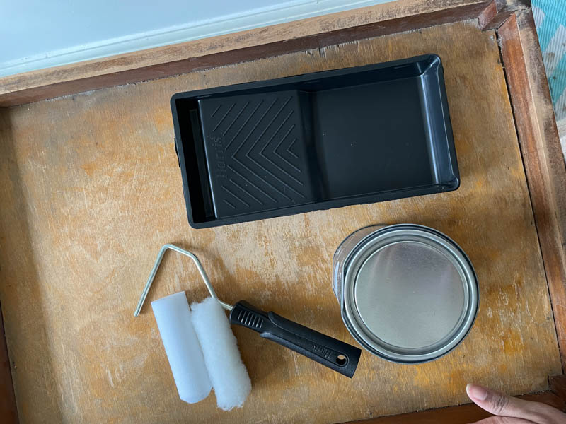 Paint tray, paint roller, and paint for bar cart makeover